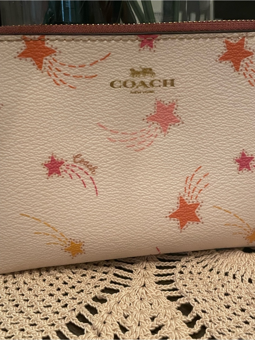 Coach Corner Zip Wristlet features a playful shooting star print - Picture 2 of 7